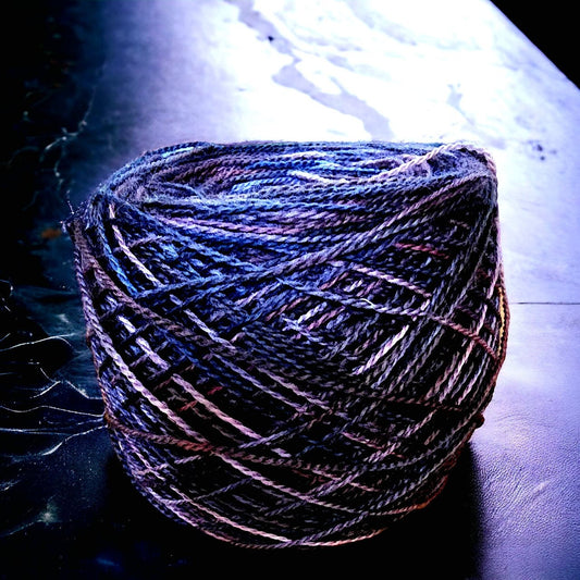 Hand dyed DK yarn. Denim blues and purples.