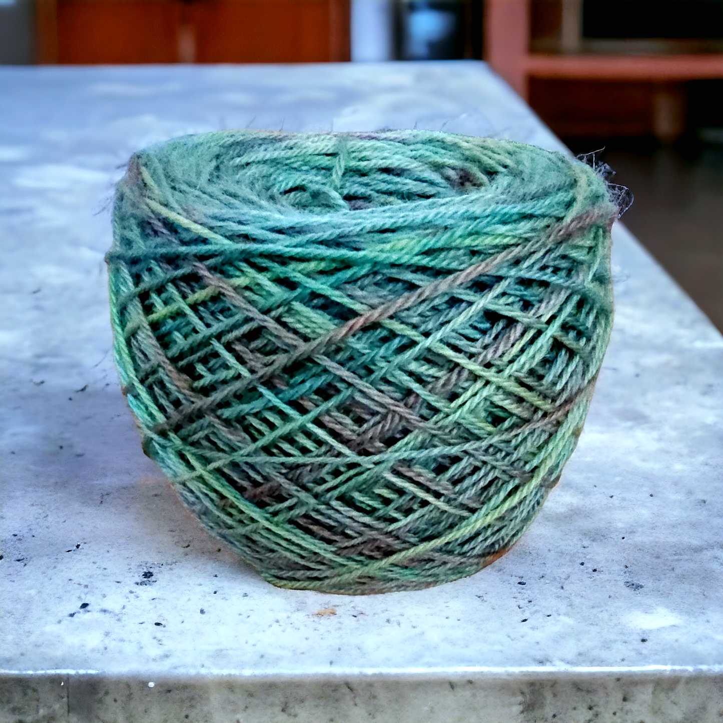 Hand dyed DK yarn in greens and lavender.