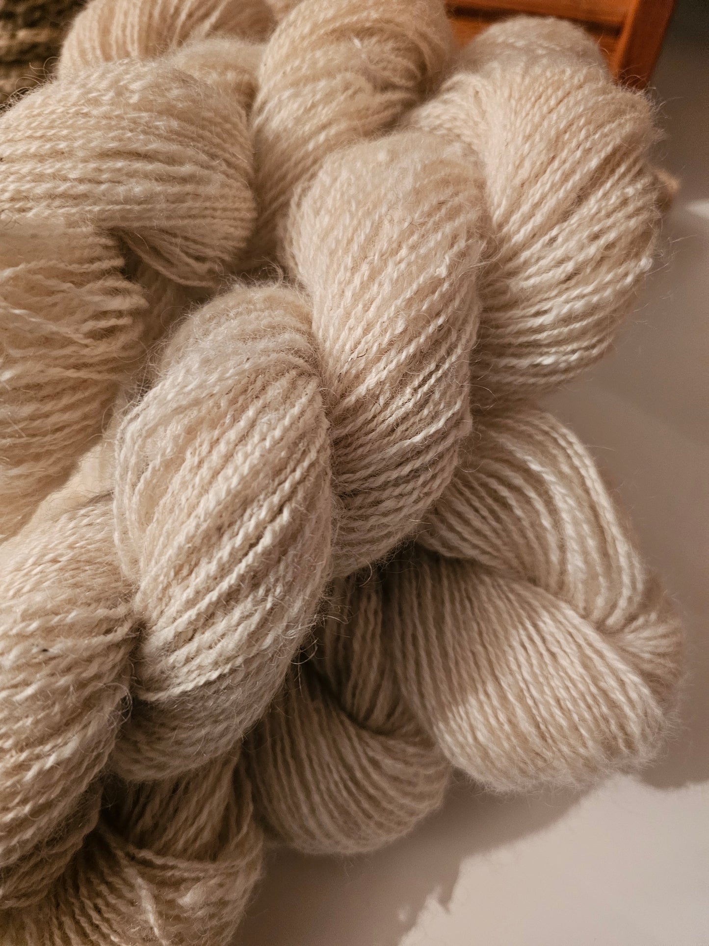 Wool spinning services.  Custom-made traditional hand spun yarn from your sheep's wool or alpaca.