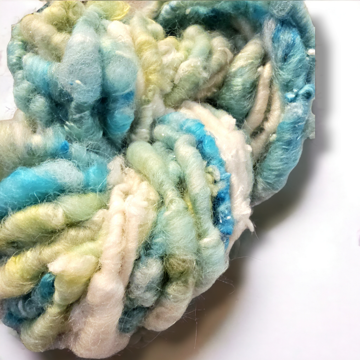 Hand-spun art yarn in Beautiful blues and greens. (Super chunky yarn)