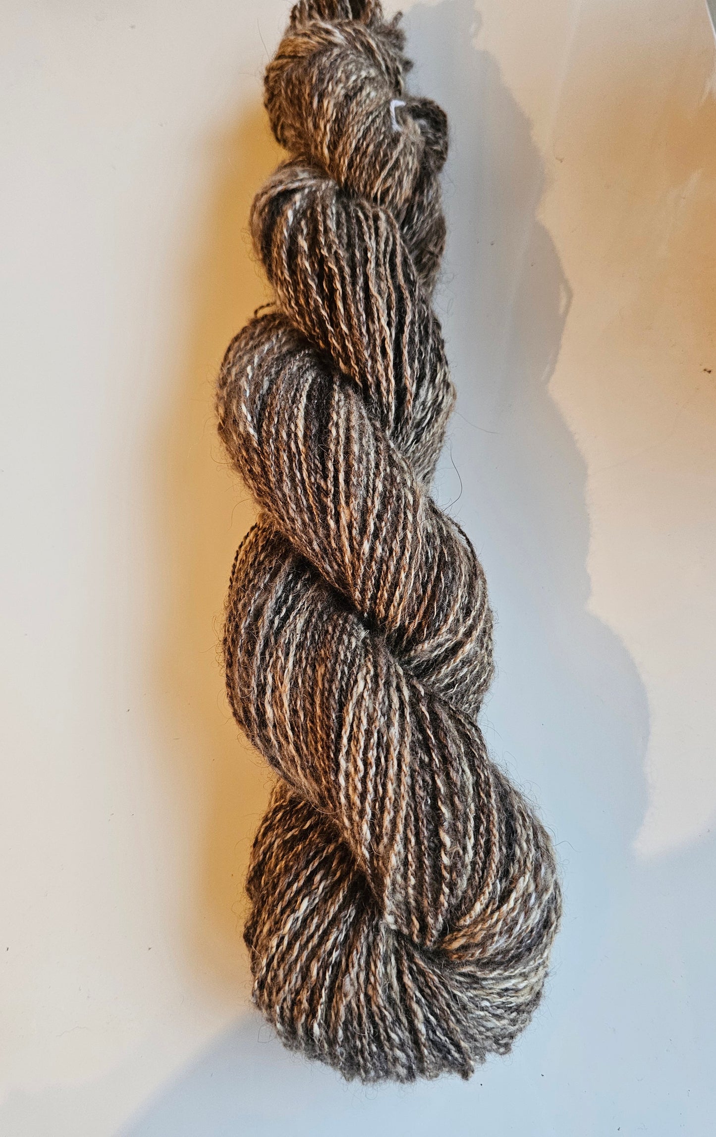 Wool spinning services.  Custom-made traditional hand spun yarn from your sheep's wool or alpaca.