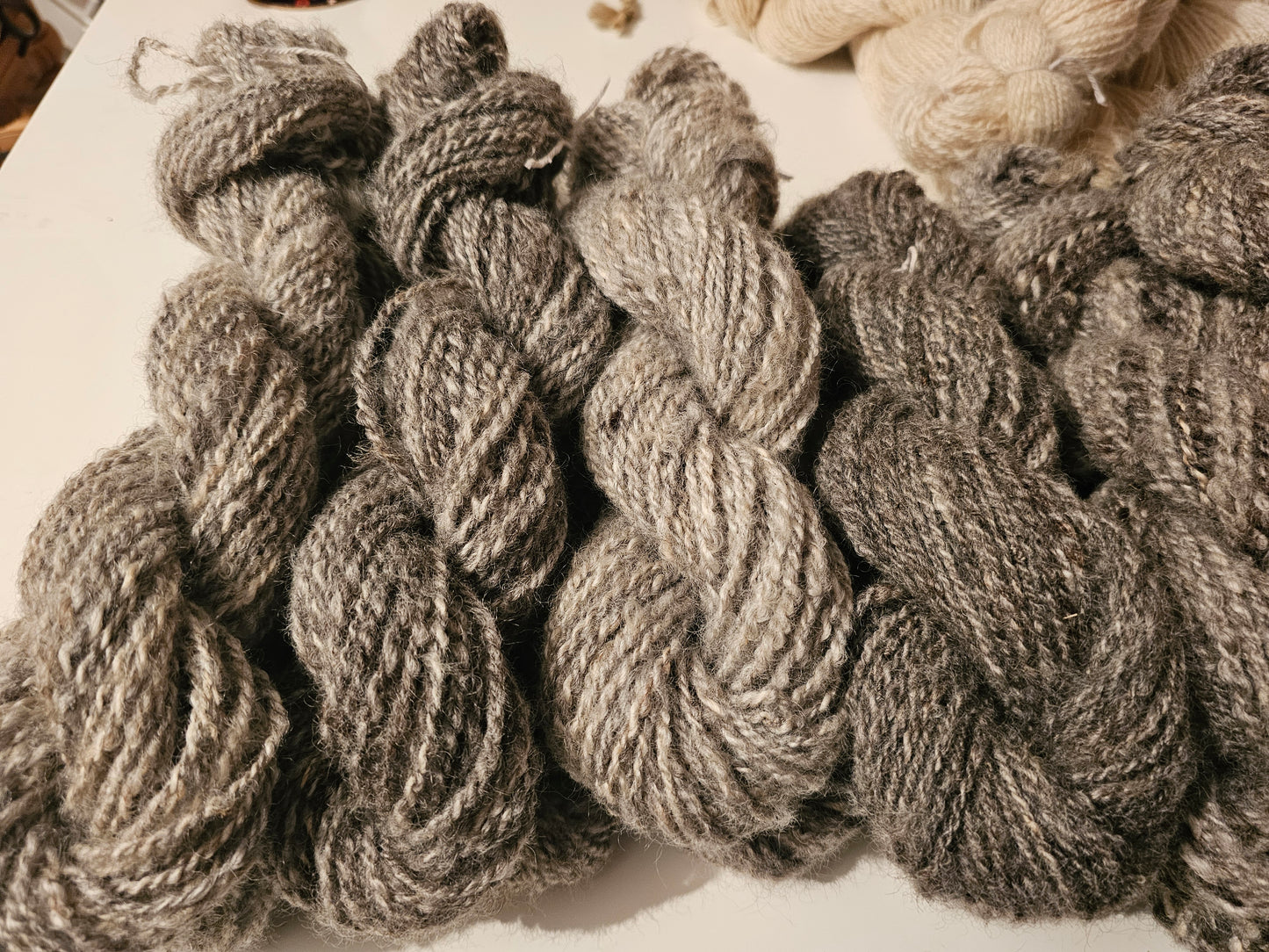 Wool spinning services.  Custom-made traditional hand spun yarn from your sheep's wool or alpaca.