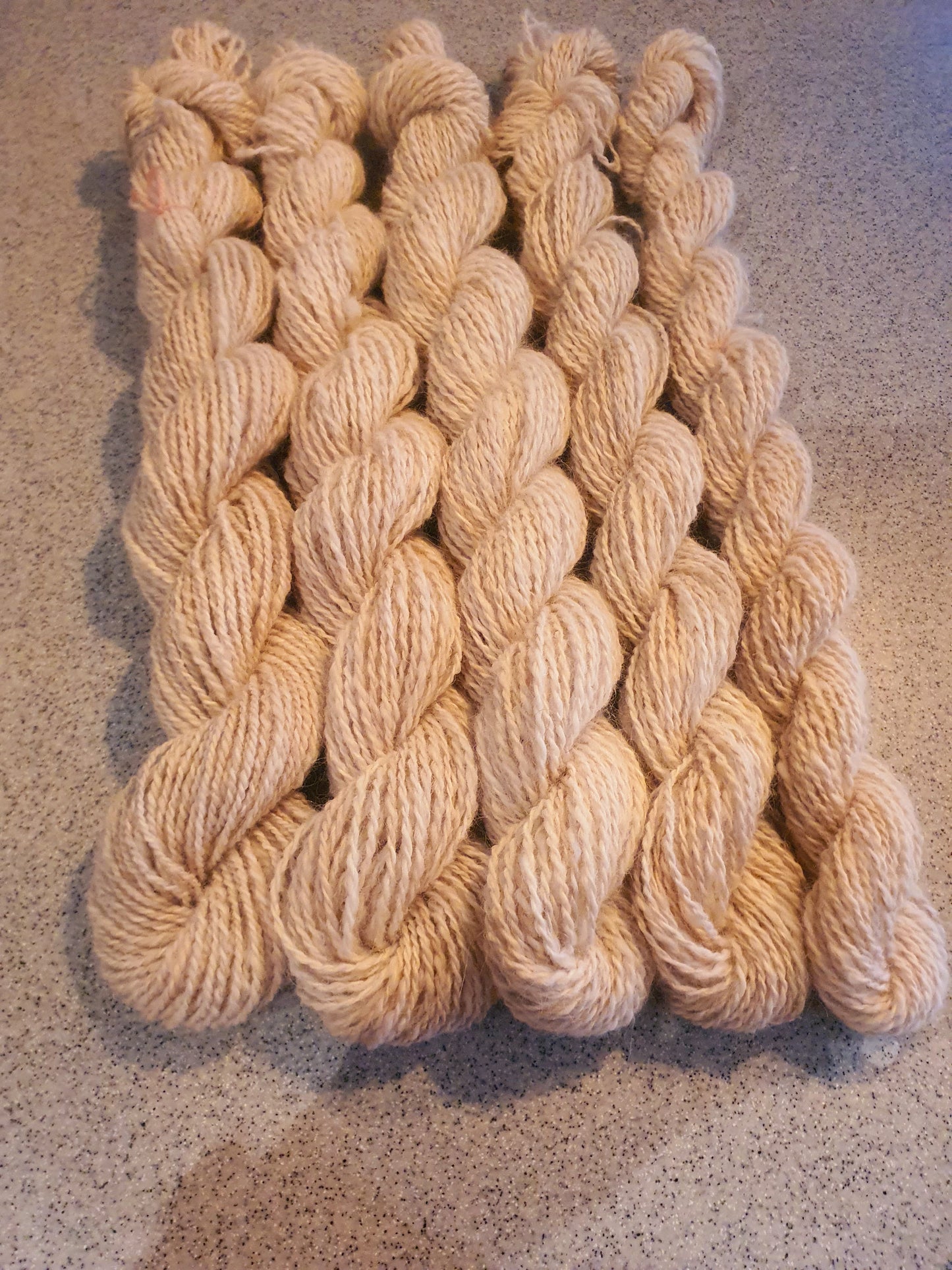 Wool spinning services.  Custom-made traditional hand spun yarn from your sheep's wool or alpaca.