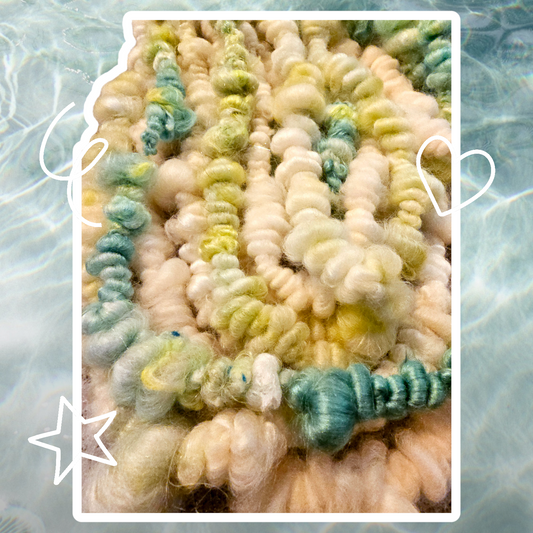 Hand-spun art yarn in Beautiful blues and greens. (Super chunky yarn)