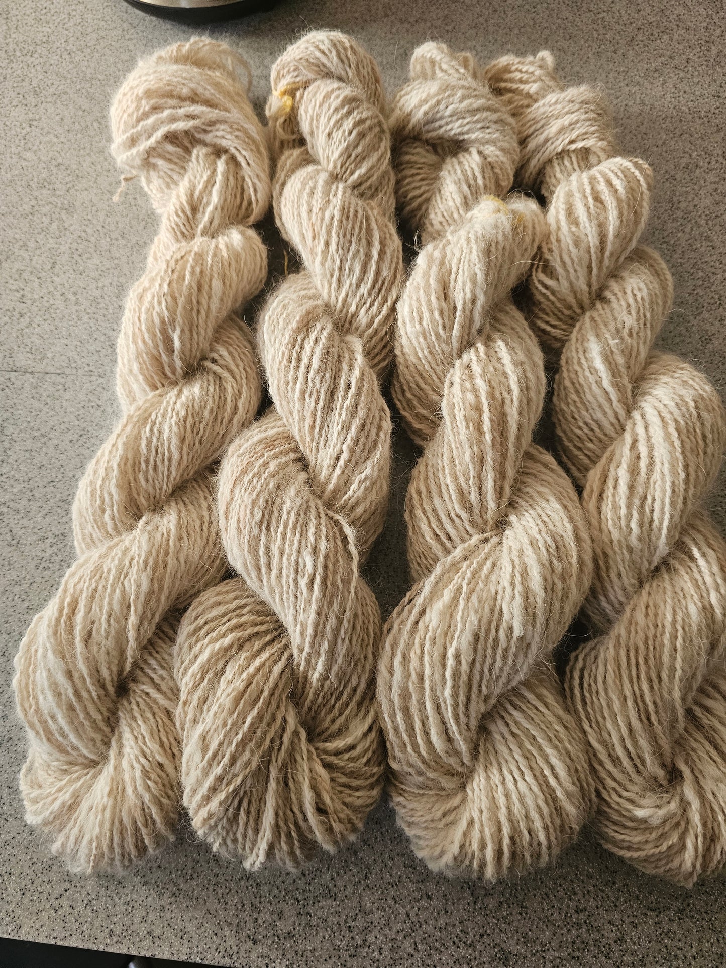 Wool spinning services.  Custom-made traditional hand spun yarn from your sheep's wool or alpaca.