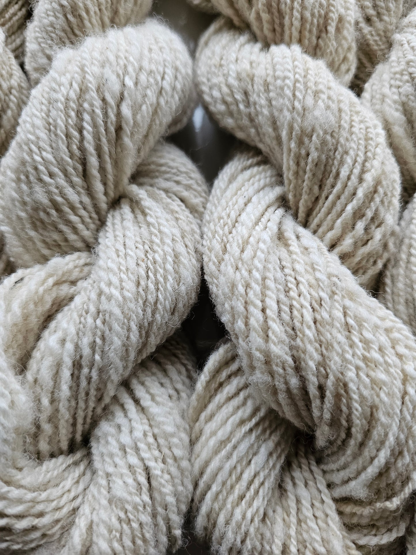 Wool spinning services.  Custom-made traditional hand spun yarn from your sheep's wool or alpaca.