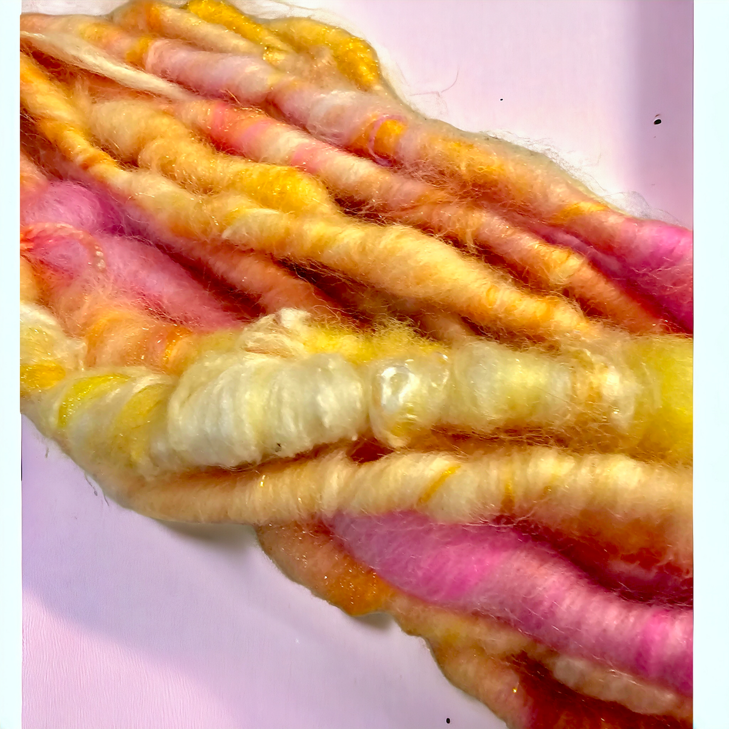 Hand-spun art yarn in Sunburst colours.