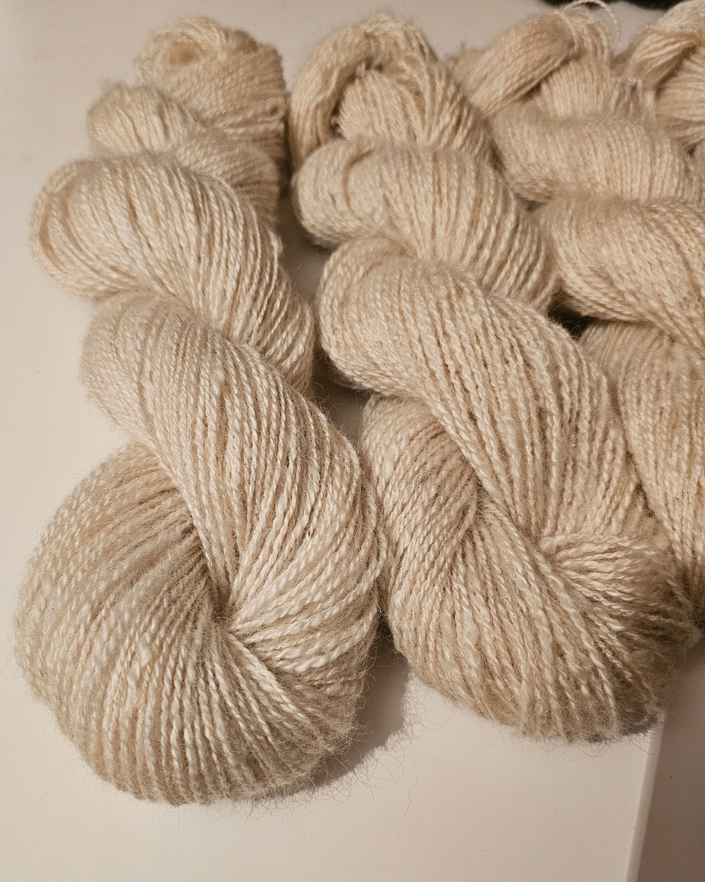 Wool spinning services.  Custom-made traditional hand spun yarn from your sheep's wool or alpaca.