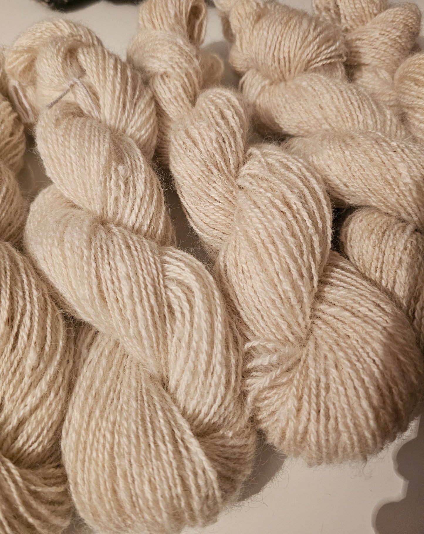 Wool spinning services.  Custom-made traditional hand spun yarn from your sheep's wool or alpaca.
