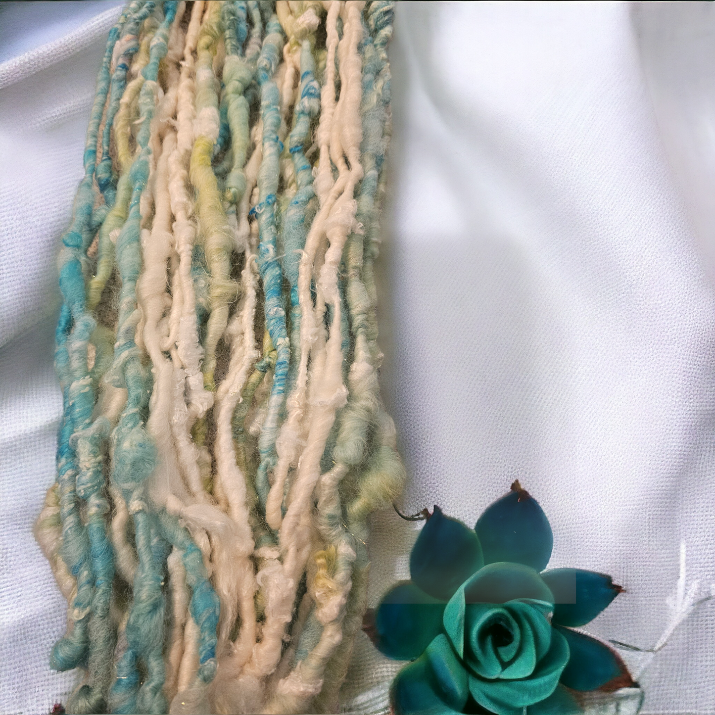 Hand-spun art yarn in Beautiful blues and greens. (Super chunky yarn)