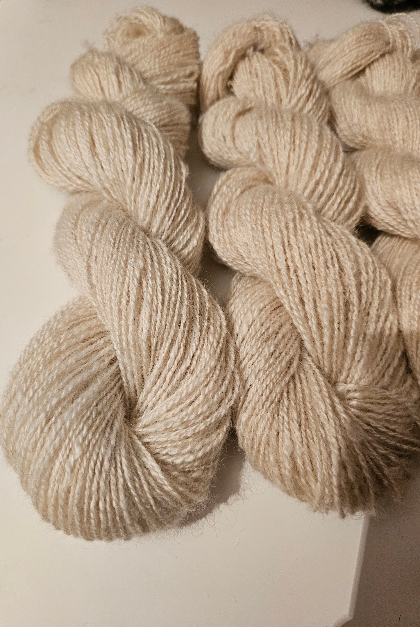 Wool spinning services.  Custom-made traditional hand spun yarn from your sheep's wool or alpaca.
