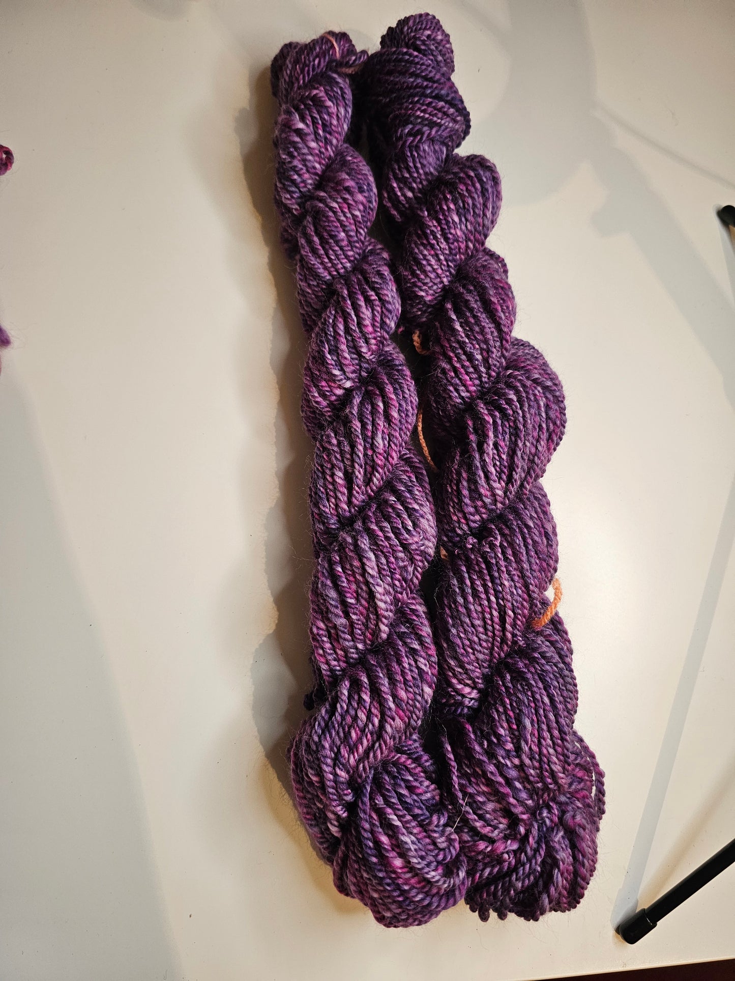Hand-spun yarn.Purples