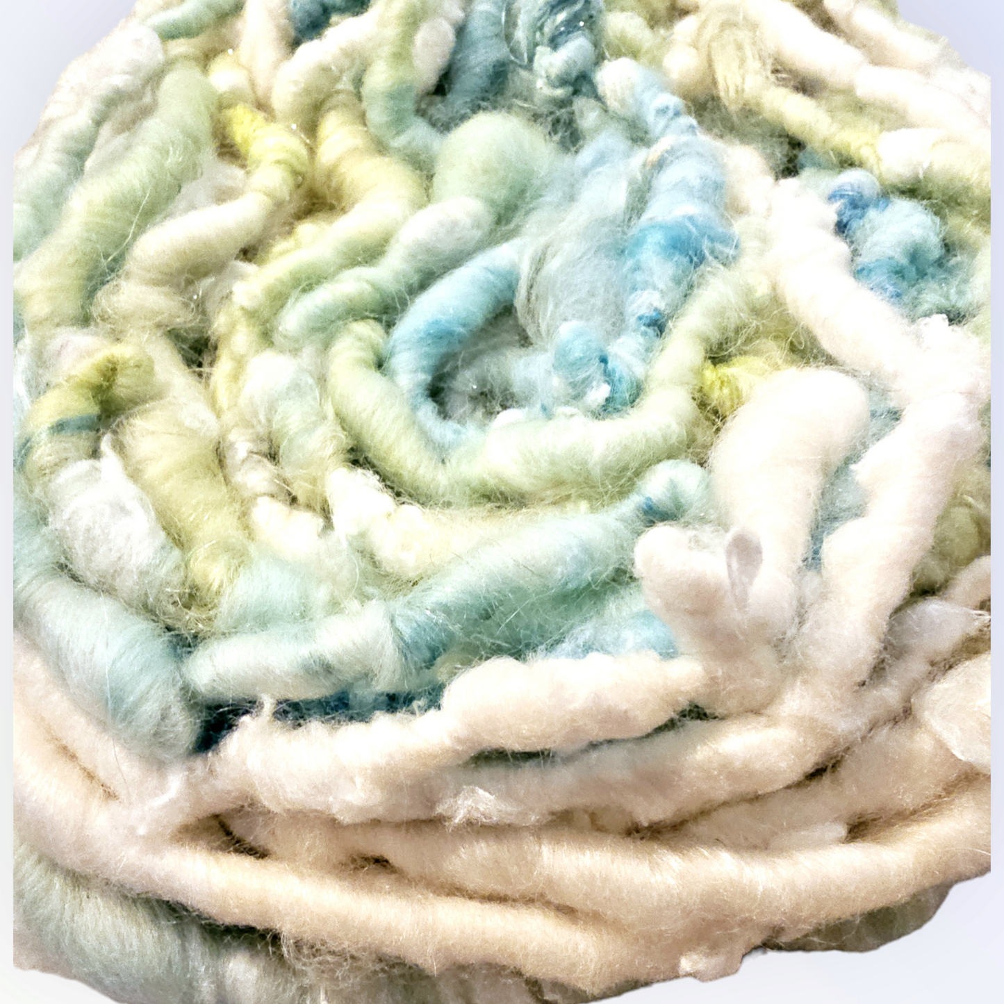 Hand-spun art yarn in Beautiful blues and greens. (Super chunky yarn)