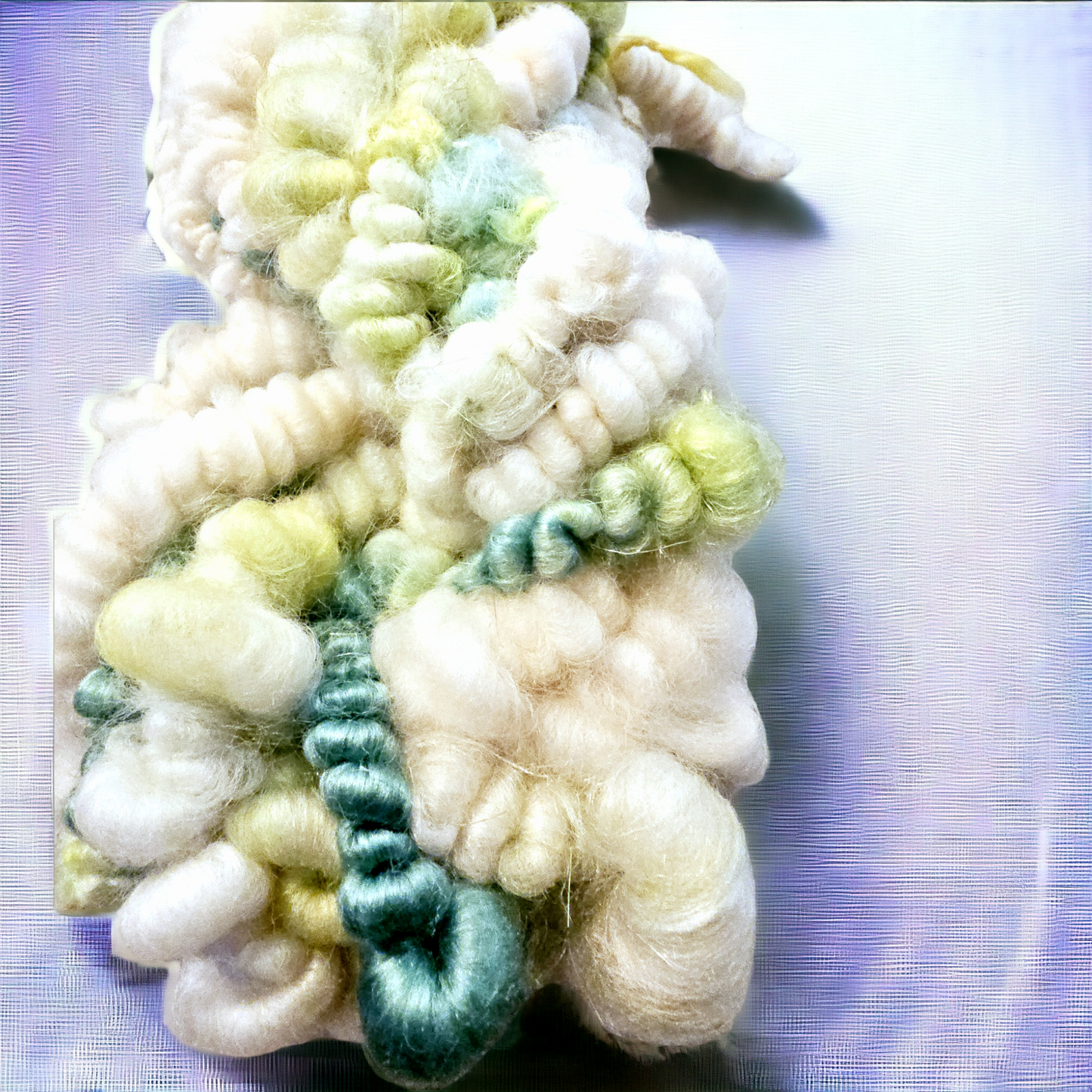 Hand-spun art yarn in Beautiful blues and greens. (Super chunky yarn)