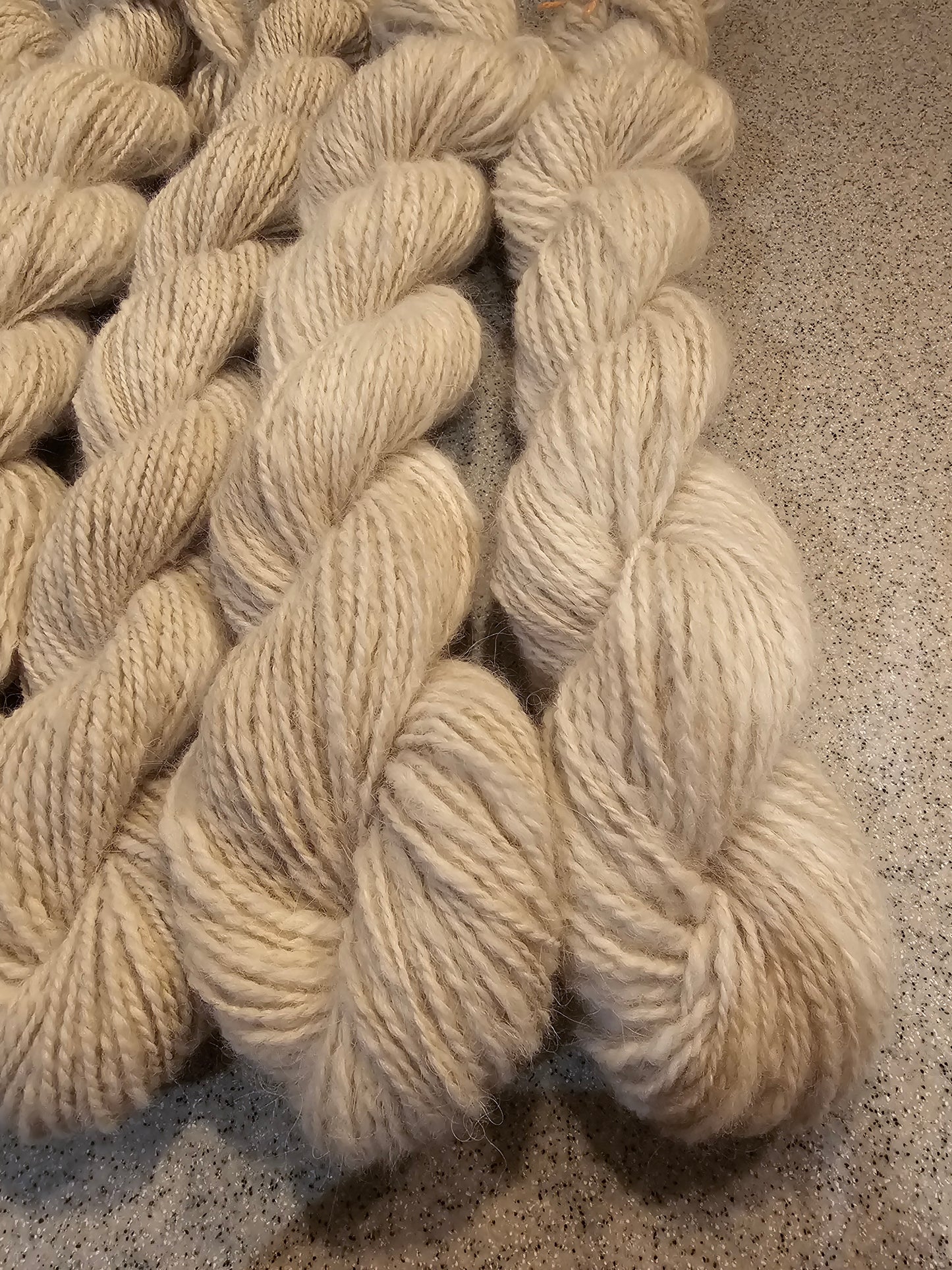 Wool spinning services.  Custom-made traditional hand spun yarn from your sheep's wool or alpaca.
