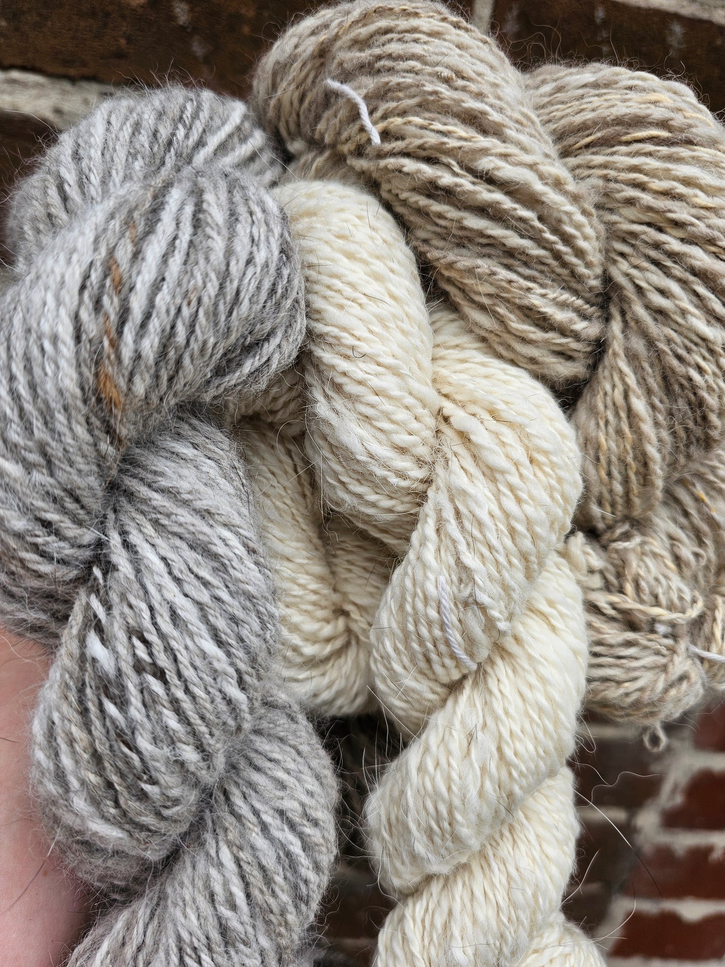 Wool spinning services.  Custom-made traditional hand spun yarn from your sheep's wool or alpaca.