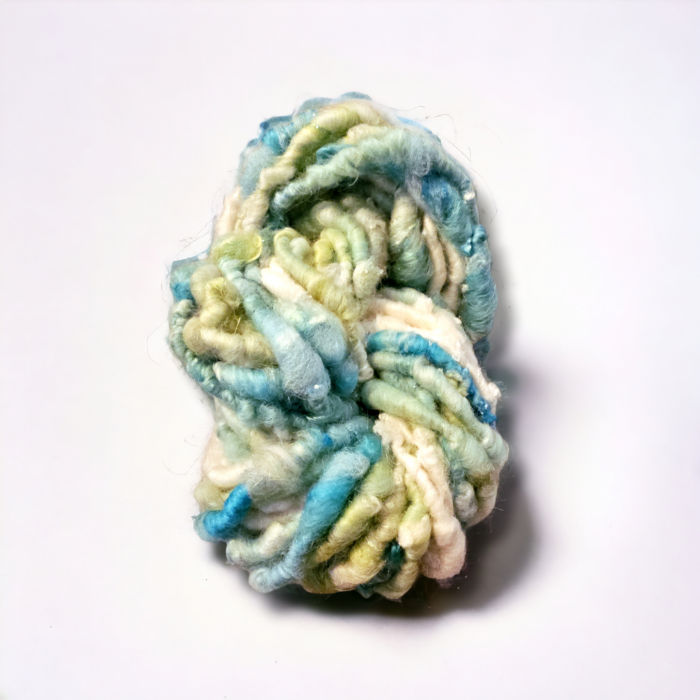 Hand-spun art yarn in Beautiful blues and greens. (Super chunky yarn)