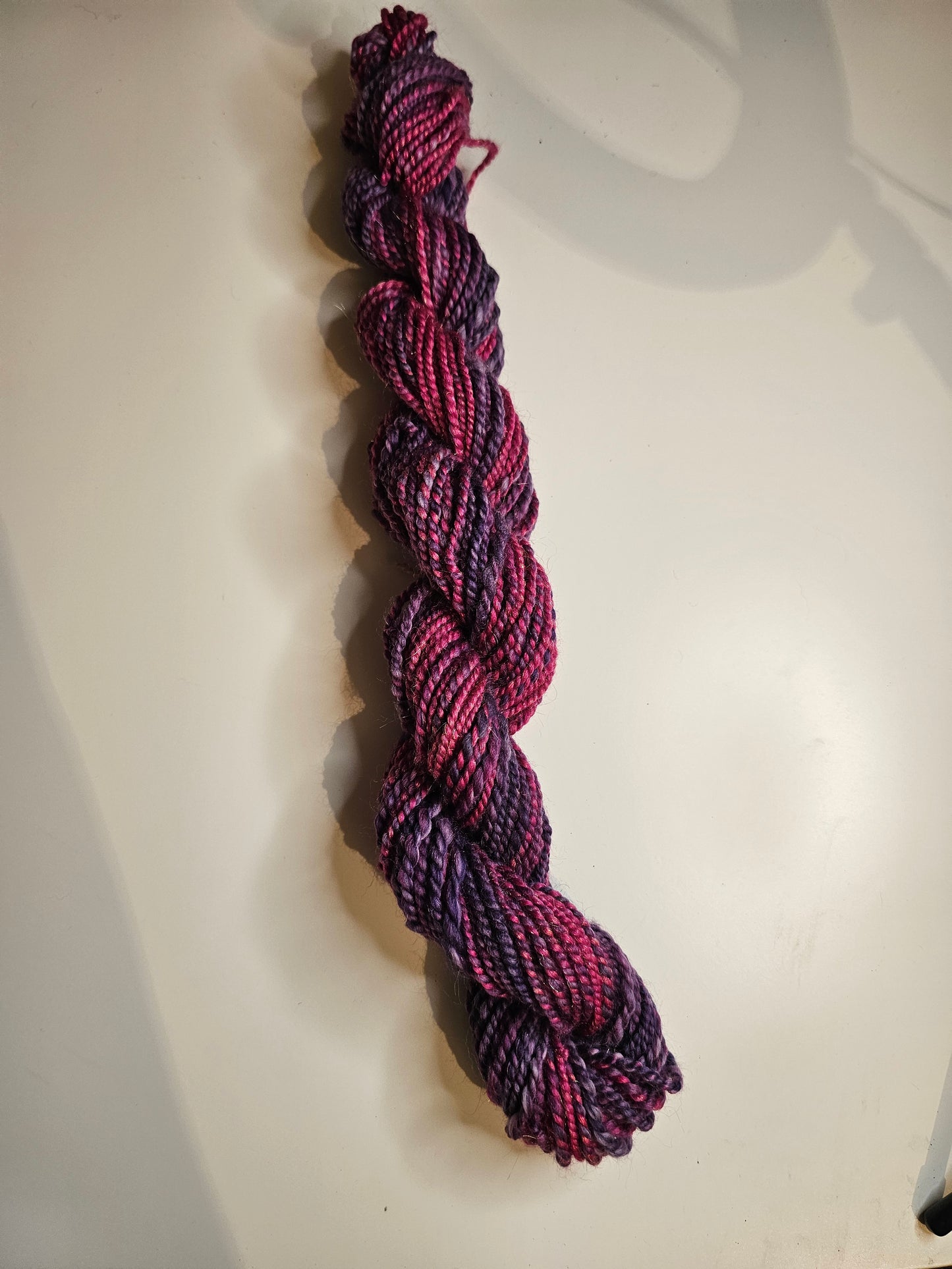 Hand-spun yarn.Purples