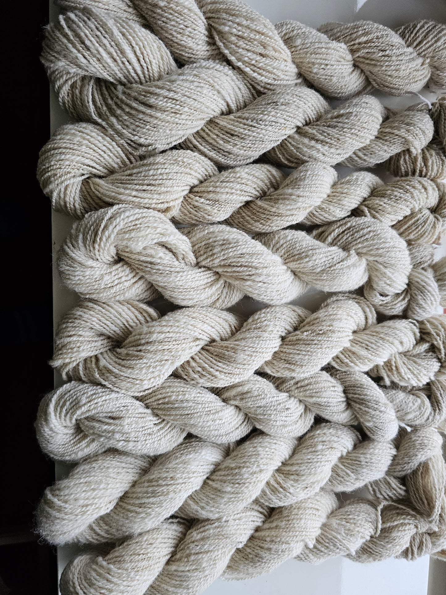 Wool spinning services.  Custom-made traditional hand spun yarn from your sheep's wool or alpaca.